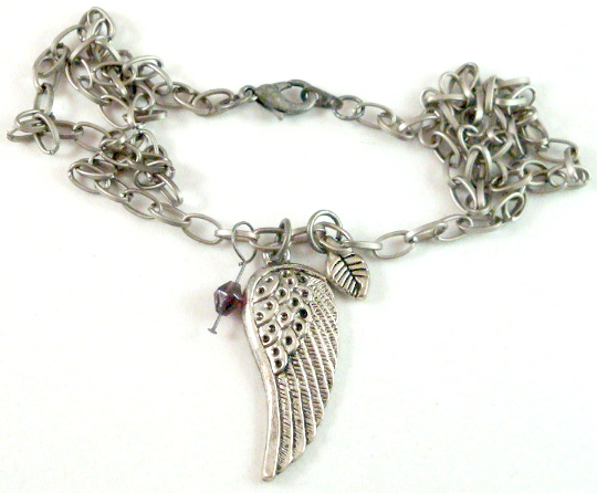 1 5/8 long Wing pendant with purple