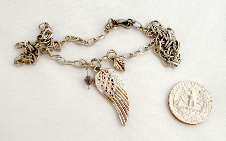 1 5/8 long Wing pendant with purple