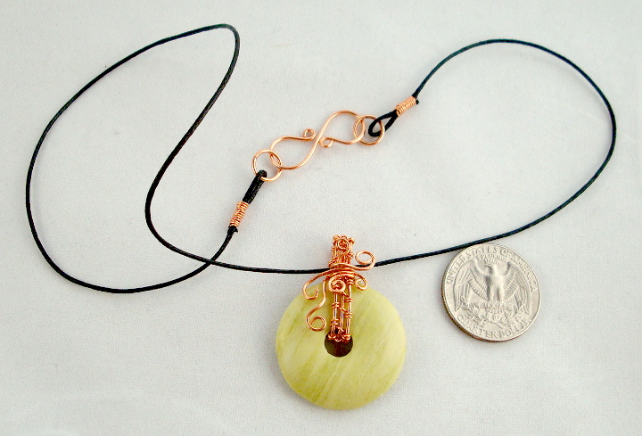 Stone donut pendent wrapped with copper 1
