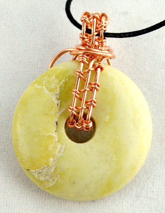 Stone donut pendent wrapped with copper 2