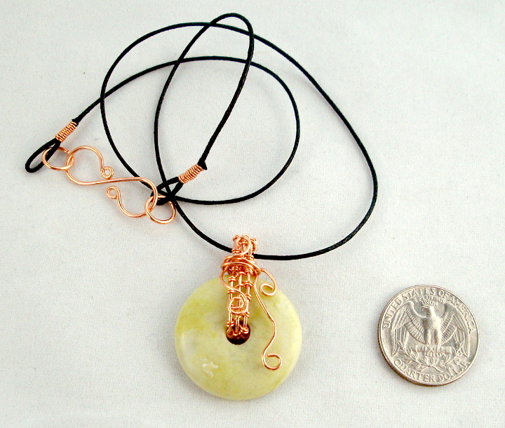Stone donut pendent wrapped with copper 2
