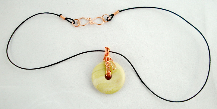 Stone donut pendent wrapped with copper 3