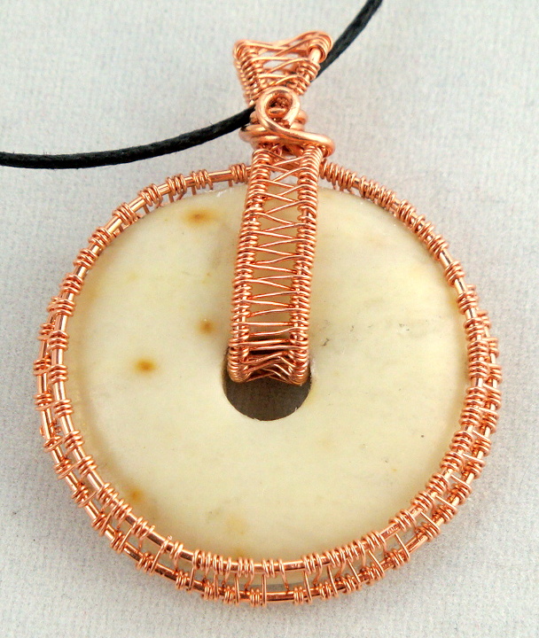 Stone donut pendent wrapped with copper 6
