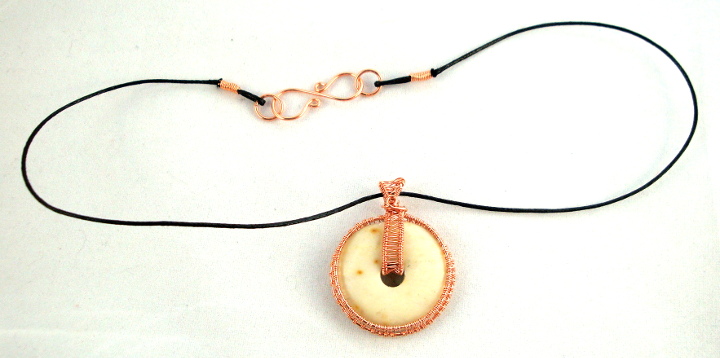 Stone donut pendent wrapped with copper 6