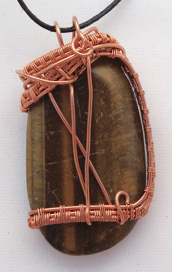 Brown stone wrapped with copper wire