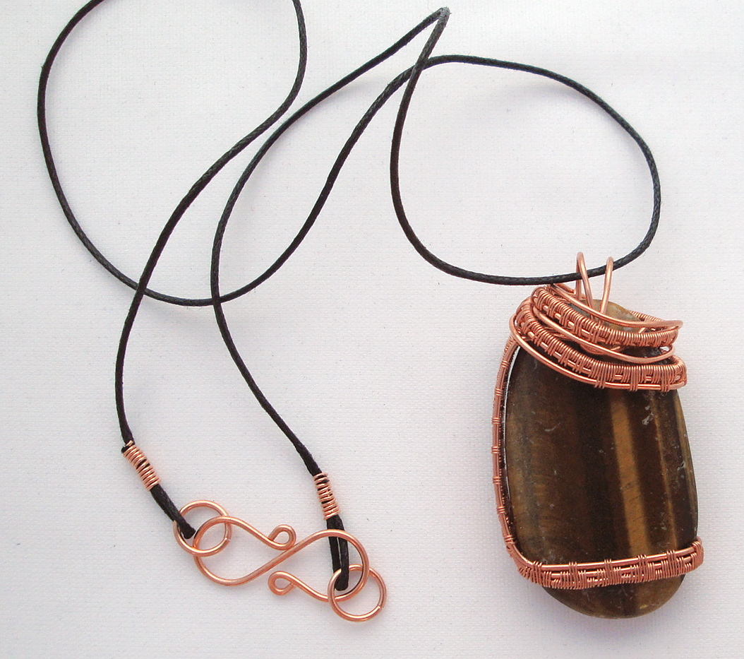 Brown stone wrapped with copper wire