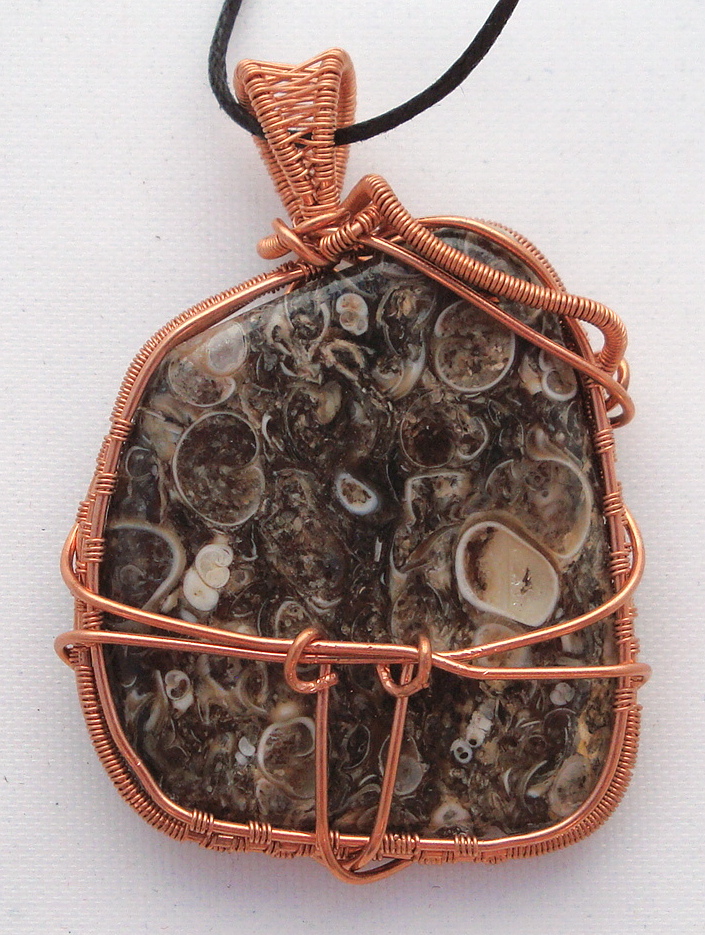 Fossil stone wrapped with copper wire