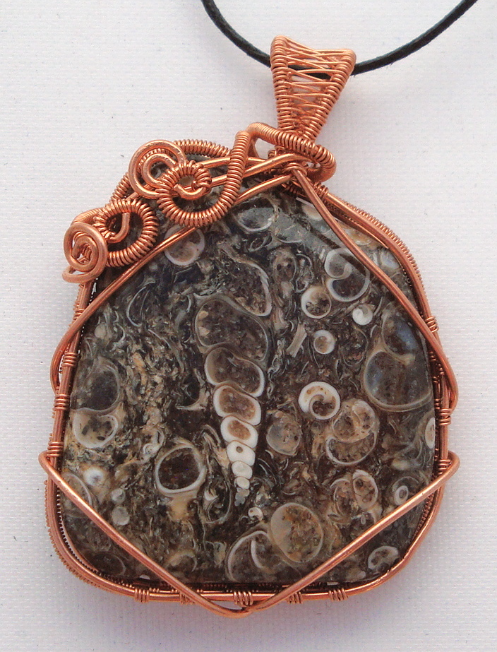 Fossil stone wrapped with copper wire