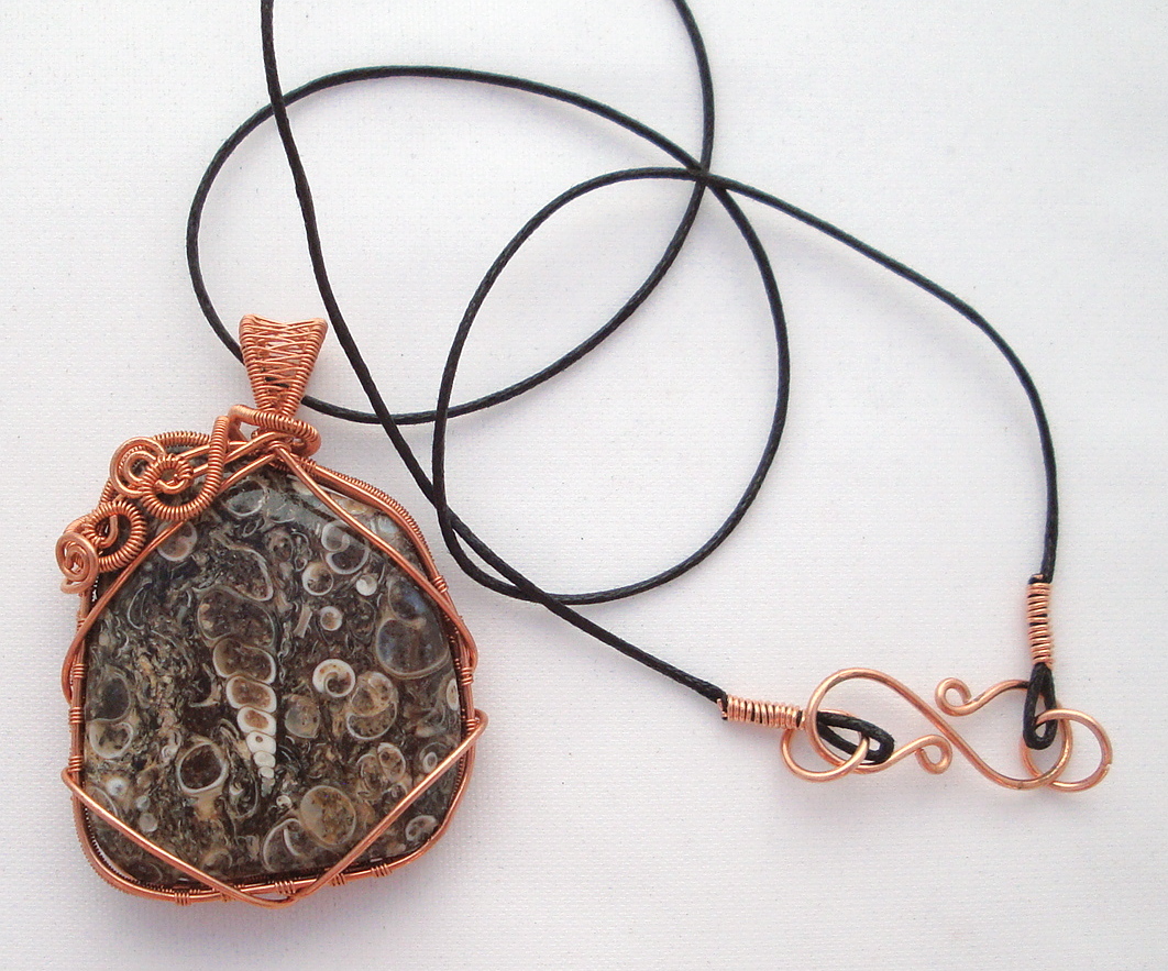 Fossil stone wrapped with copper wire