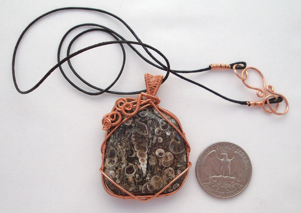 Fossil stone wrapped with copper wire