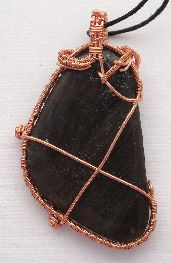 Black stone wrapped with copper wire