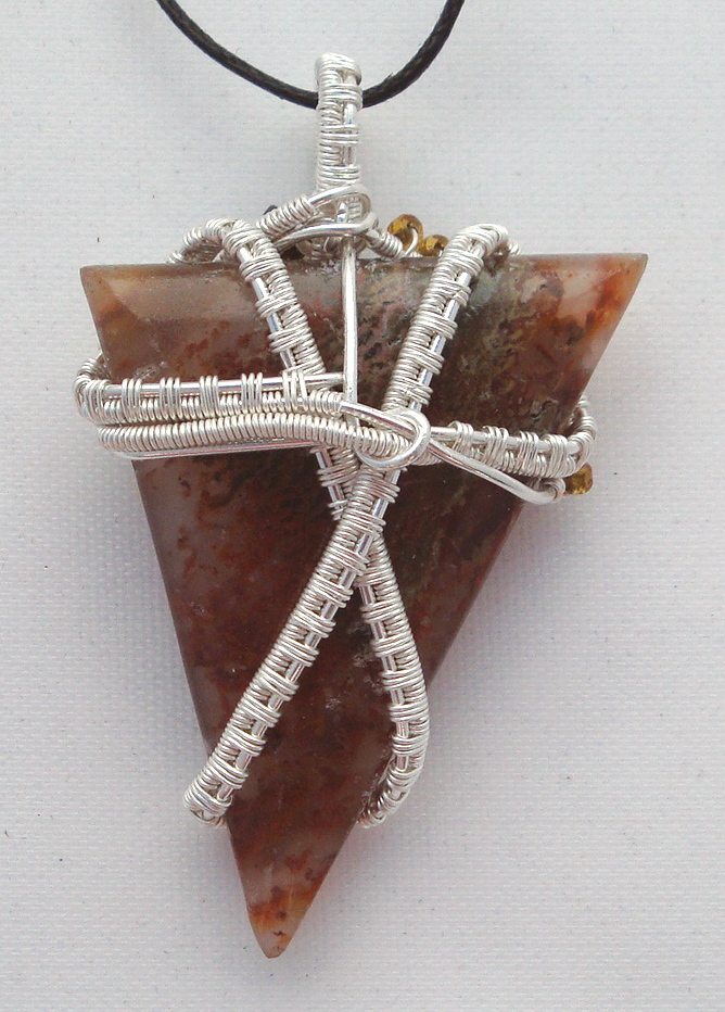 Clear-brown stone wrapped with silver wire