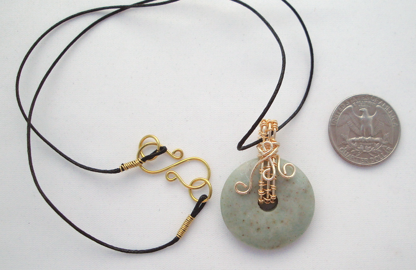 Stone donut pendent wrapped with bronze 1