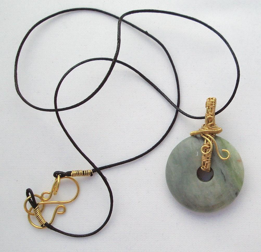 Stone donut pendent wrapped with bronze 3