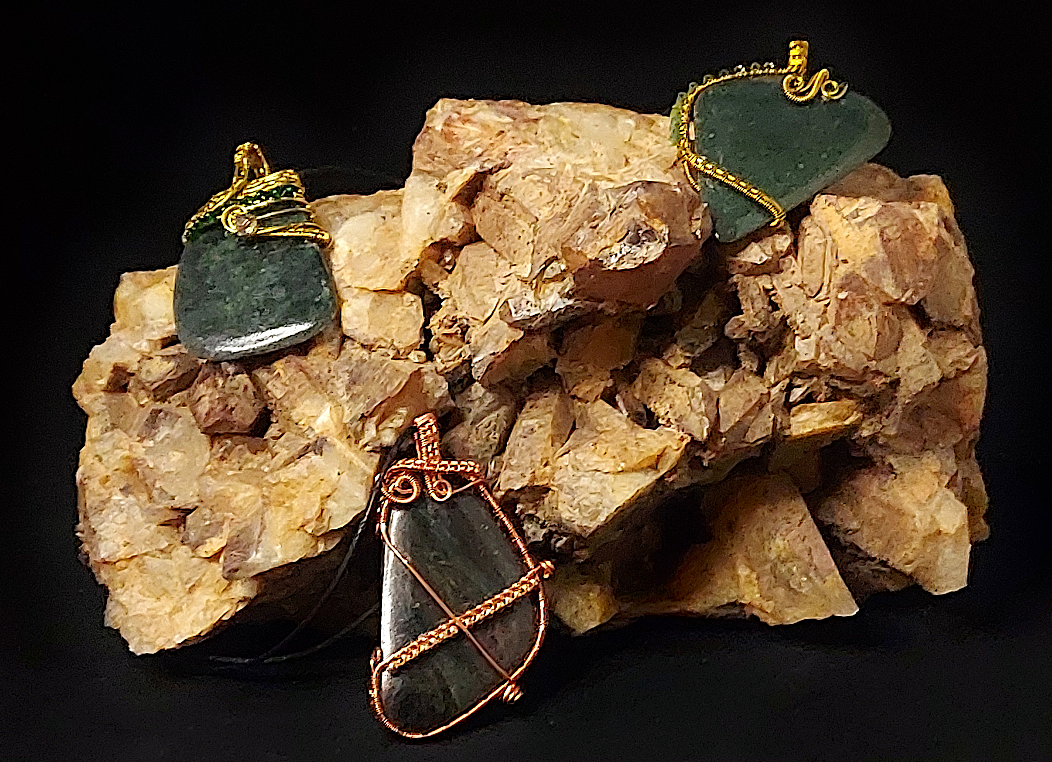 Dark green stone wrapped with bronze wire
