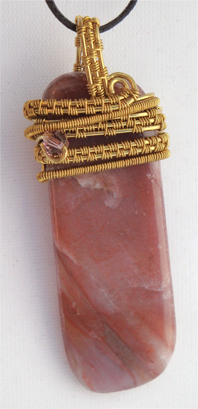 Pink striped stone wrapped with bronze wire