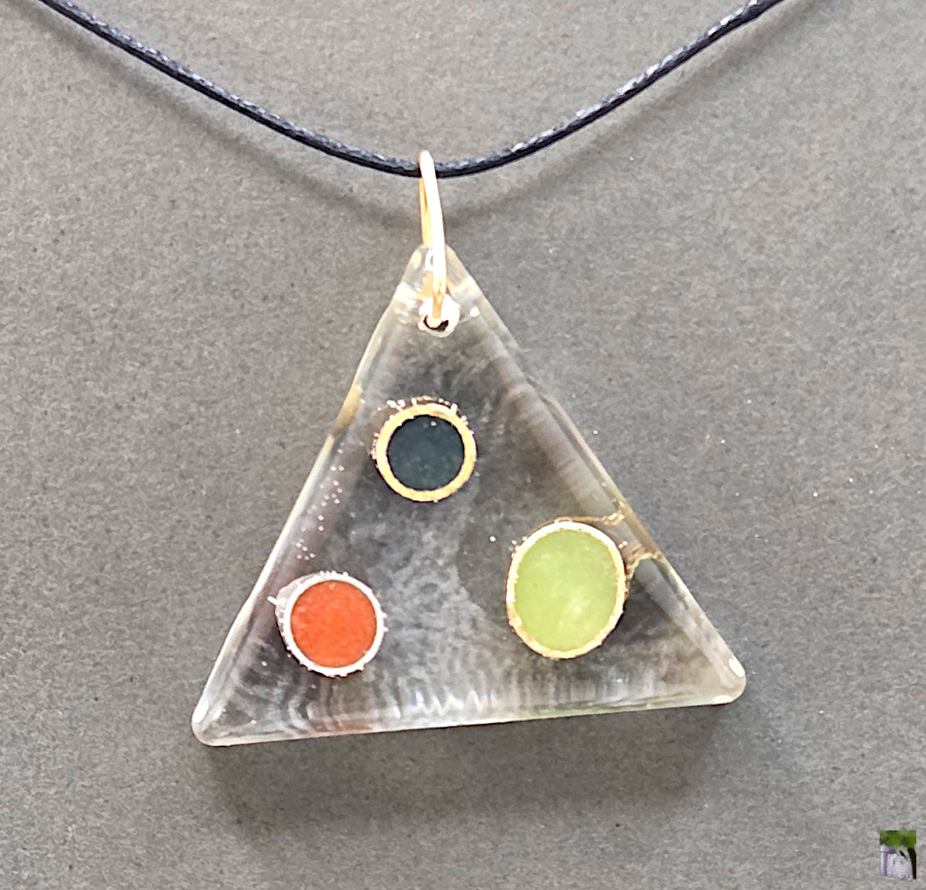 Large resin pendants with color inclusions.