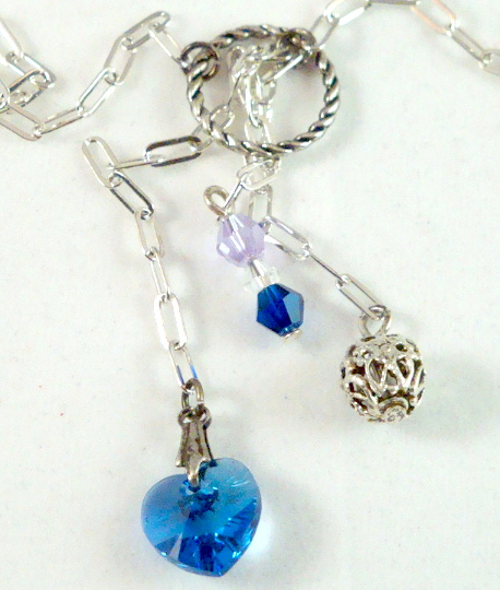 Silver lariat style necklace: blue, green, pink, yellow