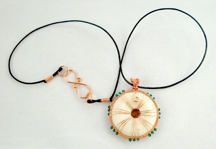 Stone donut pendent wrapped with copper and crystals 2