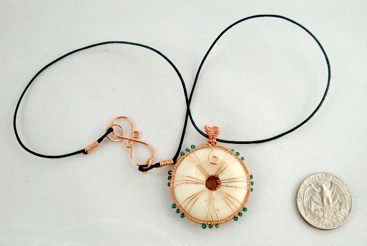 Stone donut pendent wrapped with copper and crystals 2
