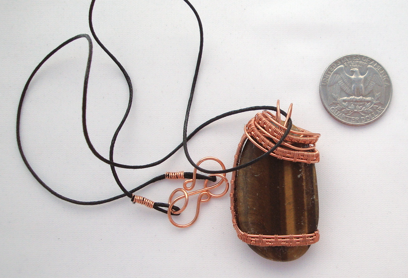 Brown stone wrapped with copper wire