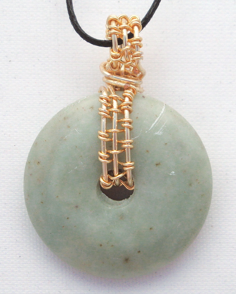 Stone donut pendent wrapped with bronze 1