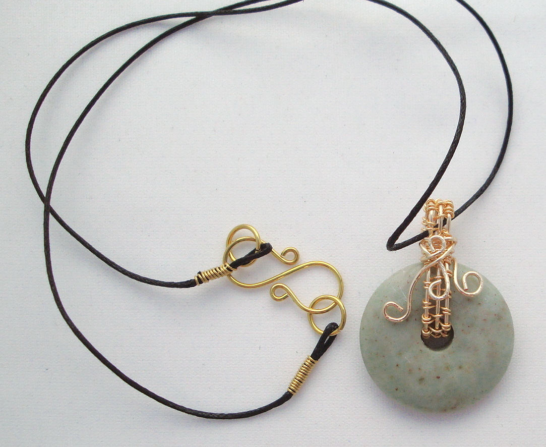 Stone donut pendent wrapped with bronze 1