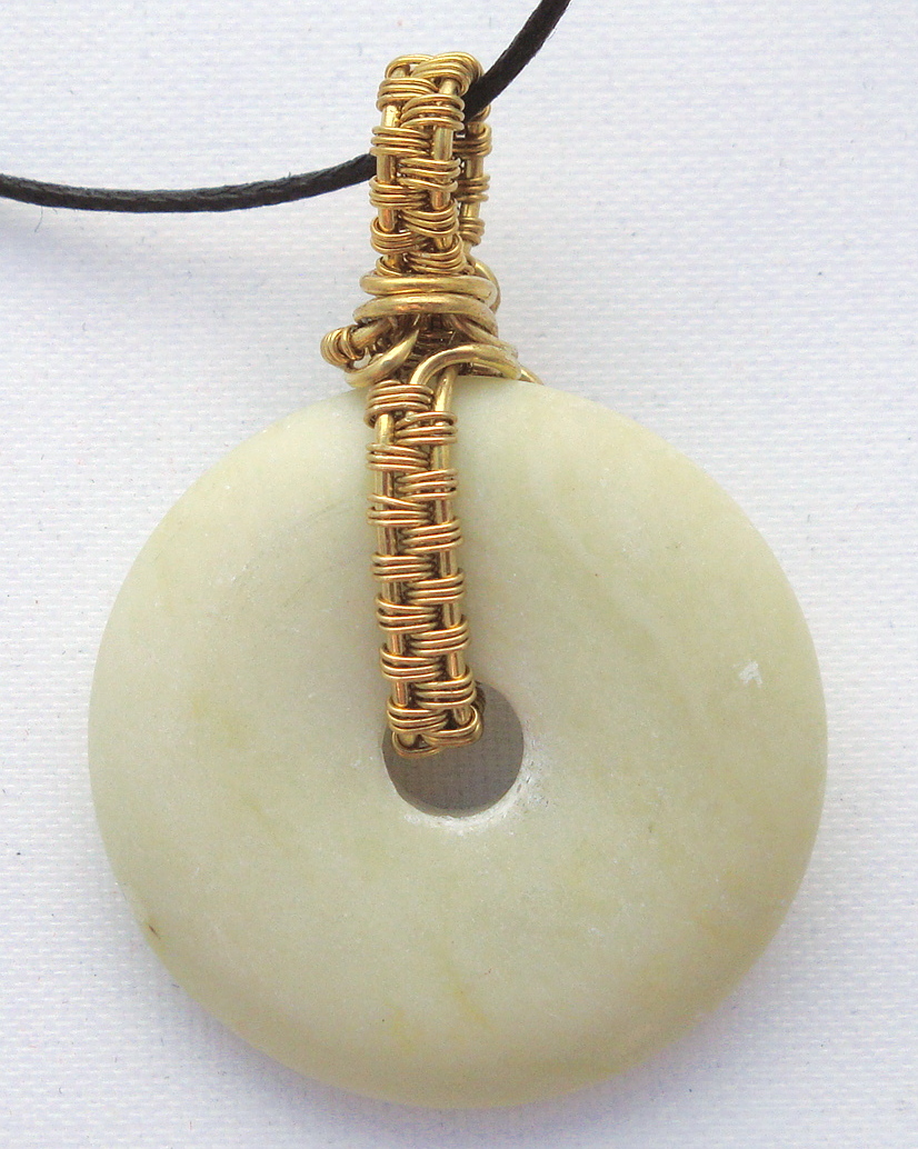 Stone donut pendent wrapped with bronze 2